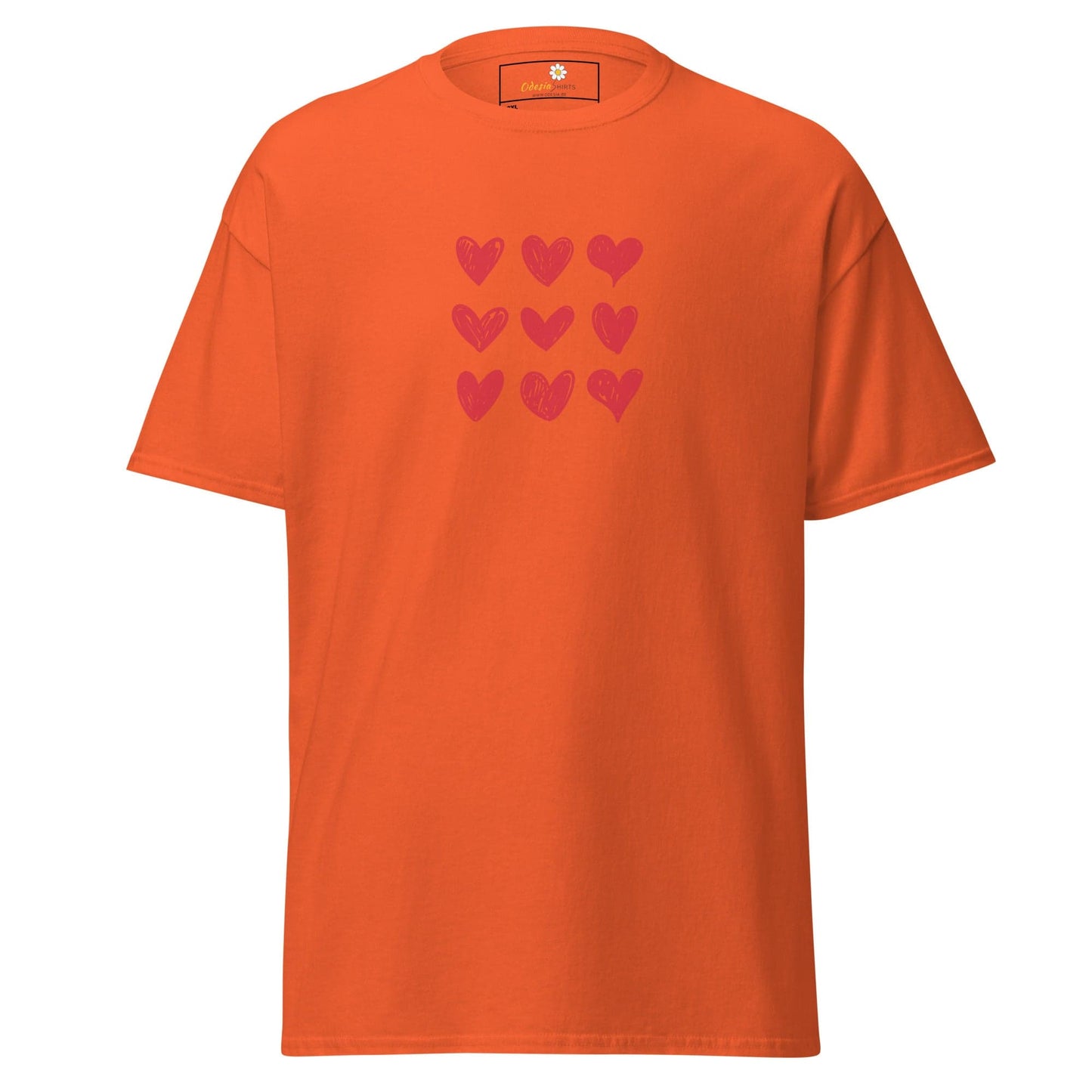Orange t-shirt with pink hearts.